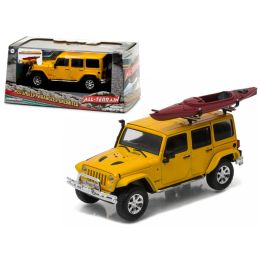 2016 Jeep Wrangler Unlimited Metallic Yellow with Winch, Snorkel, and Kayak With Display Showcase 1/43 Diecast Model Car by Greenlight