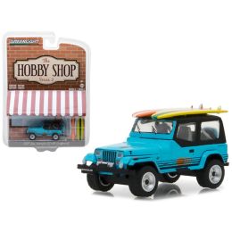 1987 Jeep Wrangler YJ Blue with Surf Board \The Hobby Shop\ Series 2 1/64 Diecast Model Car by Greenlight